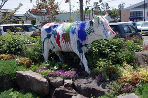 Cow statue covered in paint