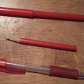 Three red pens